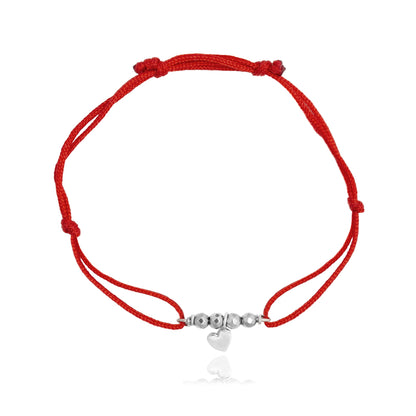 Pulsera corazón Amore de plata con hilo rojo