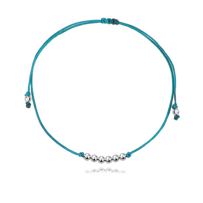 Pulsera Básica de hilo azul claro con bolitas de plata