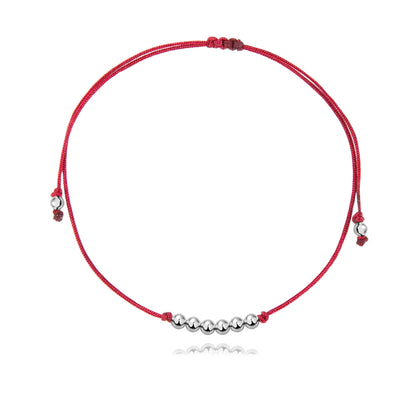 Pulsera Básica de hilo rojo con bolitas de plata